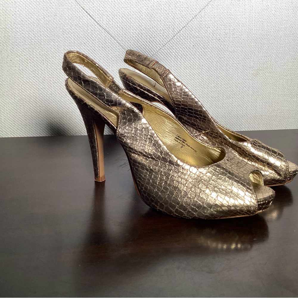 Gold heels with snake skin pattern